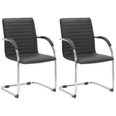 Set di 2 sedie visitatori Tira in pelle sintetica nera, design robusto e confortevole per ambienti moderni.