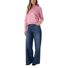 Outfit completo con felpa rosa Tommy Hilfiger Jeans Donna e jeans larghi. Stile casual per la stagione autunno/inverno.