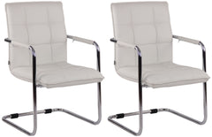 Set di 2 sedie Gandia in ecopelle bianca con struttura cromata, eleganti e moderne per ogni ambiente.