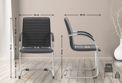 Set di 2 sedie visitatori Tira in pelle sintetica nera, design robusto e confortevole per ambienti moderni.