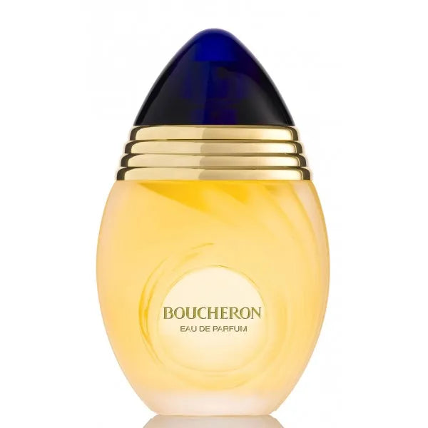 Flacone ovoidale di eau de parfum giallo oro di Boucheron con tappo blu scuro e fasce dorate.