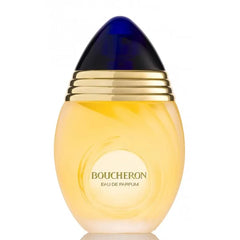Flacone ovoidale di eau de parfum giallo oro di Boucheron con tappo blu scuro e fasce dorate.