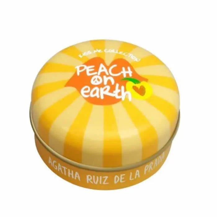 Balsamo labbra rotondo giallo e arancione di Agatha Ruiz De La Prada, con coperchio a strisce e scritta "PEACH on earth".