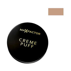 Max Factor Creme Puff Powder Compact 05 Translucent con confezione nera elegante e tonalità beige visibile, ideale per un trucco viso uniforme.